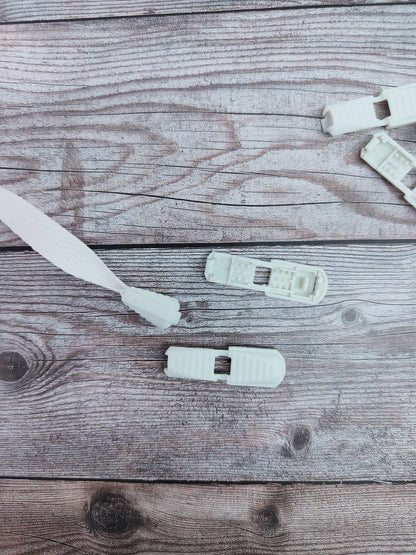 White Pinch Close Cord Ends Pair